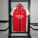 camisa-arsenal-home-titular-1-2023-24-adidas-torcedor-masculina-vermelha-vermelho-branco-branca-dourada-dourado-emirates-fly-better-dorado-dorada