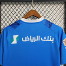 camisa-gola-v-masculina-puma-al-hilal-home-titular-1-2023-24-torcedor-azul-branco-branca-arabia-saudita-neymar-savvy-seven