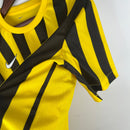 camisa-masculina-nike-al-Ittihad-home-titular-1-2023-24-torcedor-amarelo-amarela-preto-preta-arabia-saudita-benzema