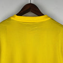 camisa-masculina-nike-al-Ittihad-home-titular-1-2023-24-torcedor-amarelo-amarela-preto-preta-arabia-saudita-benzema