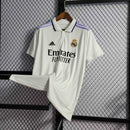 camisa-real-madrid-madri-home-titular-1-2022-23-adidas-emirates-fly-better-torcedor-masculina-branca-branco-lilas-cr7-vini-jr-kroos