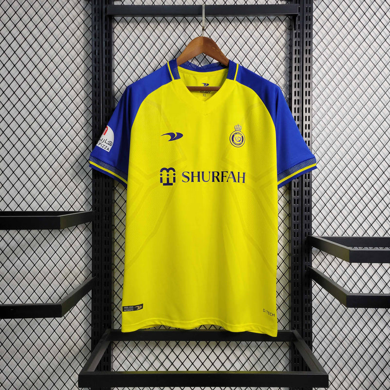 camisa-al-nassr-home-1-titular-2022-23-duneus-torcedor-masculina-masculino-amarela-amarelo-azul-cr7-cristiano-ronaldo-alvaro-gonzalez-luiz-gustavo-arabia-shurfah
