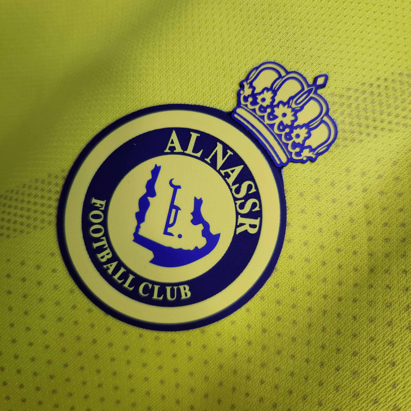 camisa-al-nassr-home-1-titular-2022-23-duneus-torcedor-masculina-masculino-amarela-amarelo-azul-cr7-cristiano-ronaldo-alvaro-gonzalez-luiz-gustavo-arabia-shurfah
