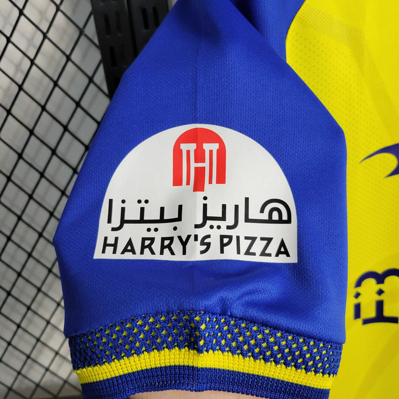 camisa-al-nassr-home-1-titular-2022-23-duneus-torcedor-masculina-masculino-amarela-amarelo-azul-cr7-cristiano-ronaldo-alvaro-gonzalez-luiz-gustavo-arabia-shurfah
