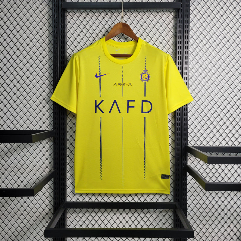 camisa-al-nassr-home-titular-1-2023-24-nike-torcedor-masculina-azul-amarelo-amarela-cr7-cristiano-ronaldo-aroya-kafd