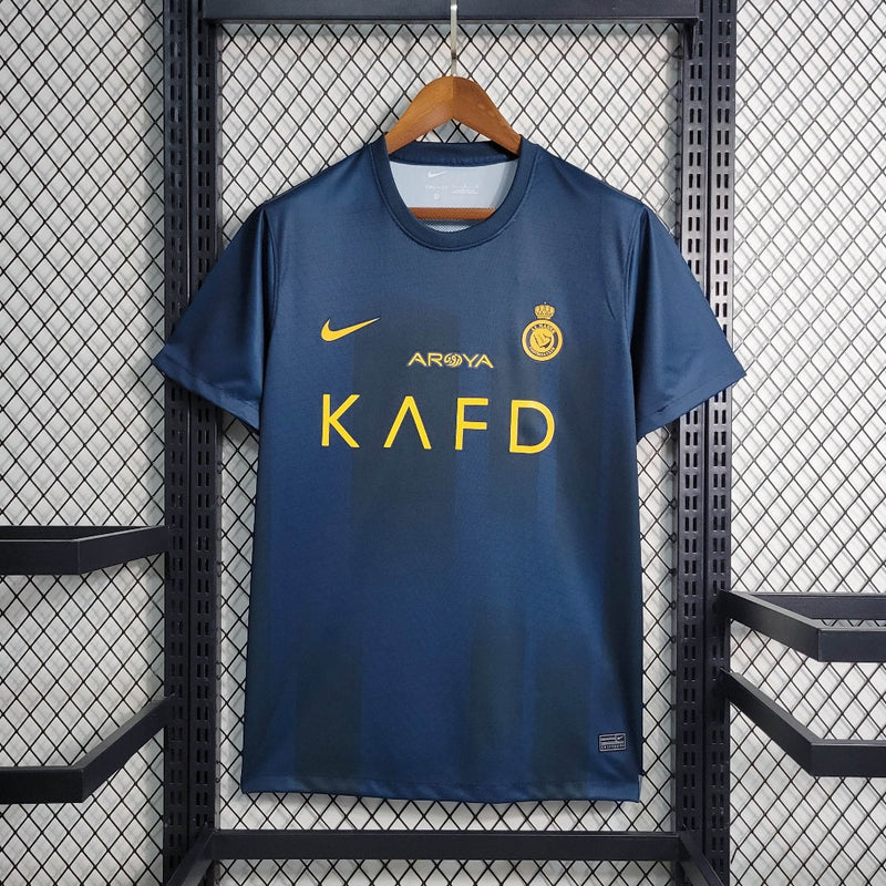 camisa-al-nassr-away-reserva-2-2023-24-nike-torcedor-masculina-azul-amarelo-amarela-cr7-cristiano-ronaldo-aroya-kafd