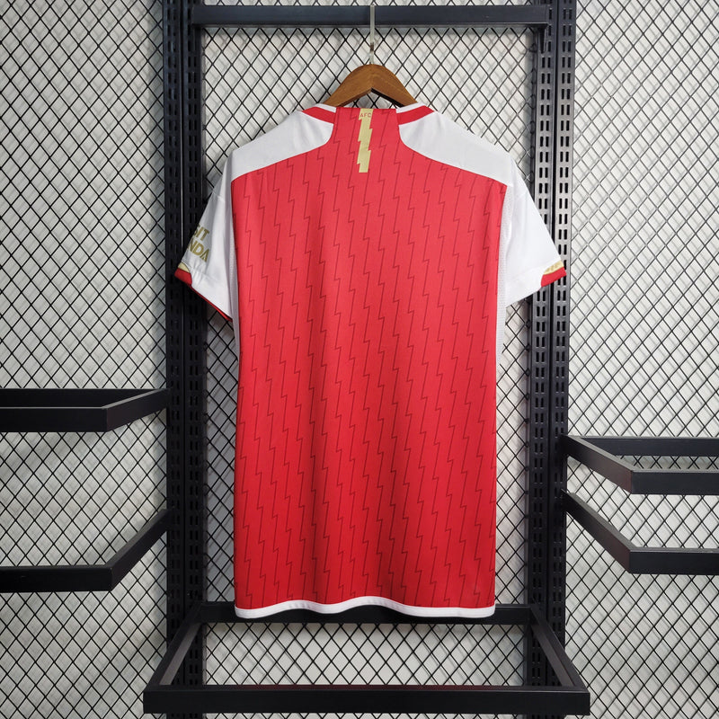 camisa-arsenal-home-titular-1-2023-24-adidas-torcedor-masculina-vermelha-vermelho-branco-branca-dourada-dourado-emirates-fly-better-dorado-dorada