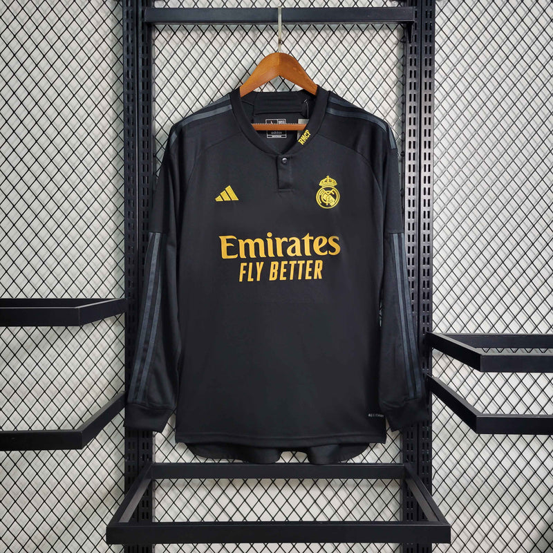 camisa-manga-longa-comprida-third-3-terceira-madrid-2023-24-adidas-emirates-fly-better-torcedor-masculina-masculino-preto-preta-dourado-dourada-dorado-dorada-vini-jr-mbappe-rodrygo-modric-bellingham-endrick-valverde-carvajal-lucas-vasquez