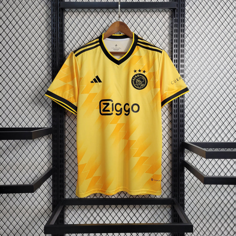 camisa-masculina-adidas-ajax-2023-24-torcedor-amarelo-amarela-preto-preta-ziggo-curaçao-giganet-gola-v
