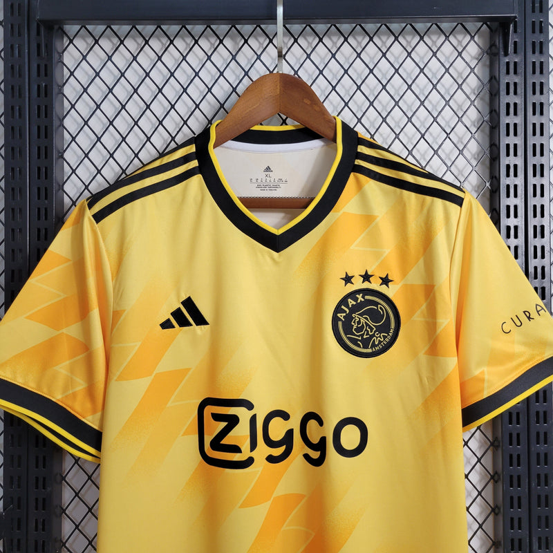 camisa-masculina-adidas-ajax-2023-24-torcedor-amarelo-amarela-preto-preta-ziggo-curaçao-giganet-gola-v
