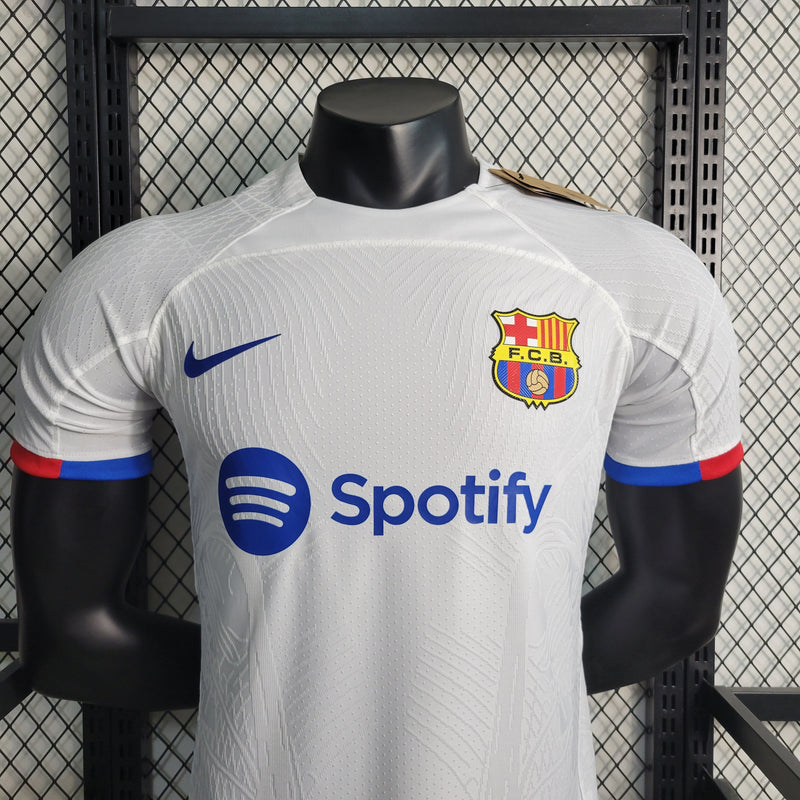 camisa-masculina-barcelona-barca-away-reserva-2-2023-24-nike-jogador-branca-branco-azul-vermelha-vermelho-spotify-unicef-fcb-messi-neymar-suarez