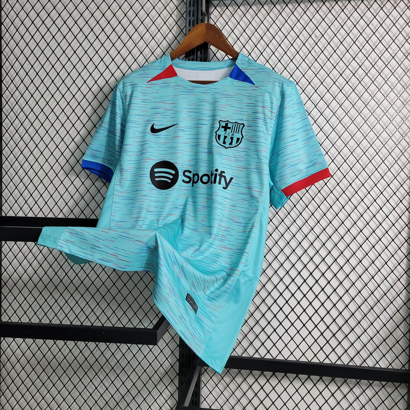 camisa-masculina-barcelona-barca-third-terceira-3-2023-24-nike-torcedor-azul-vermelha-vermelho-verde-preto-preta-fcb-spotify-messi-neymar
