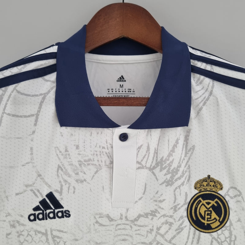 camisa-real-madrid-madri-torcedor-adidas-2023-24-branca-branco-azul-dragao-cr7-ronaldo-vini-jr-kroos-emirates-fly-better
