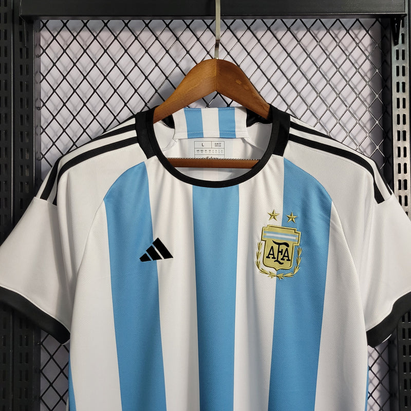 camisa-selecao-argentina-home-titular-1-2023-24-adidas-torcedor-masculina-branca-branco-azul-messi-lionel