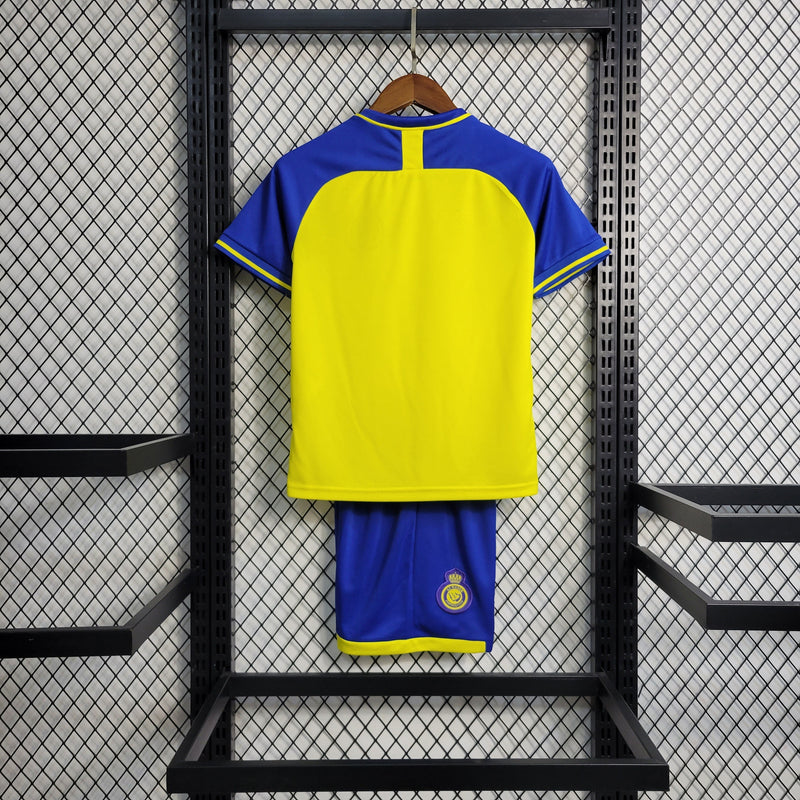 kit-conjunto-infantil-camisa-shorts-al-nassr-home-1-titular-2022-23-duneus-torcedor-masculina-masculino-azul-amarelo-amarela-cr7-cristiano-ronaldo-alvaro-gonzalez-luiz-gustavo-arabia-shurfah
