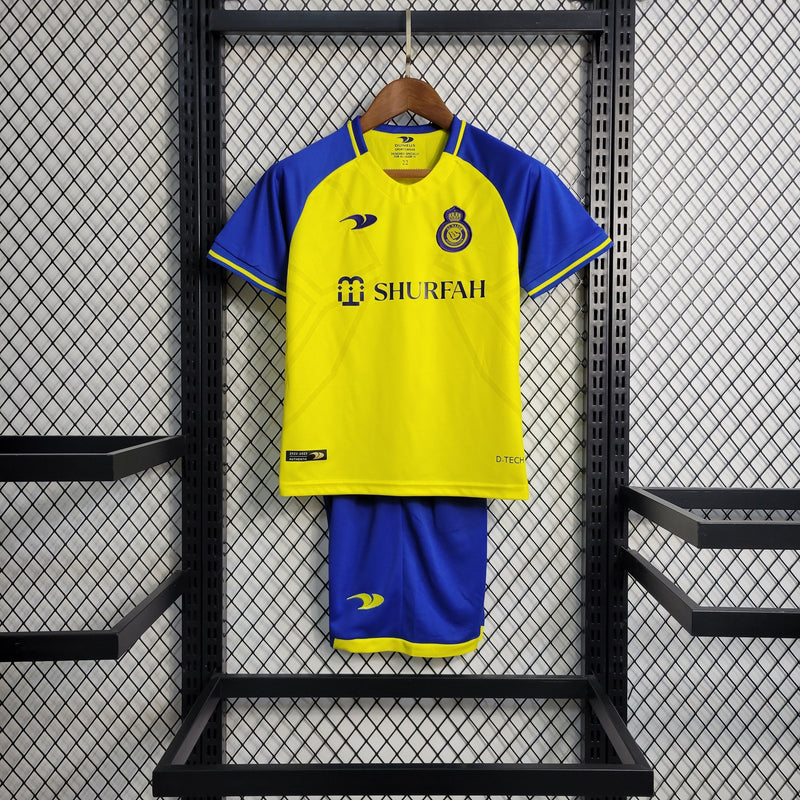 kit-conjunto-infantil-camisa-shorts-al-nassr-home-1-titular-2022-23-duneus-torcedor-masculina-masculino-azul-amarelo-amarela-cr7-cristiano-ronaldo-alvaro-gonzalez-luiz-gustavo-arabia-shurfah
