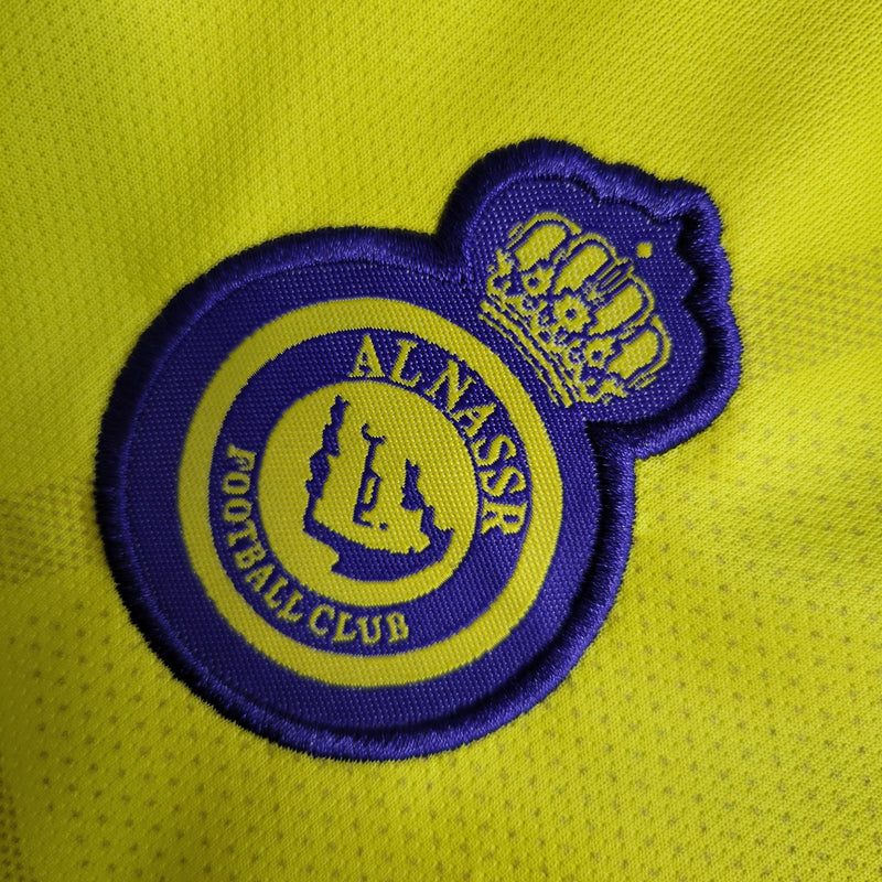 kit-conjunto-infantil-camisa-shorts-al-nassr-home-1-titular-2022-23-duneus-torcedor-masculina-masculino-azul-amarelo-amarela-cr7-cristiano-ronaldo-alvaro-gonzalez-luiz-gustavo-arabia-shurfah
