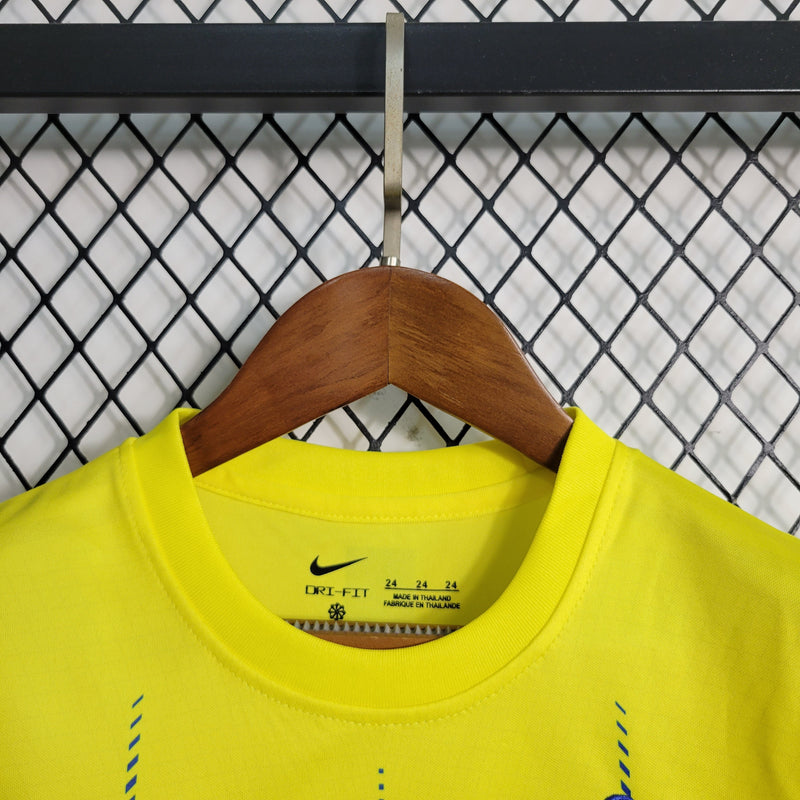 kit-conjunto-infantil-camisa-shorts-al-nassr-home-1-titular-2023-24-nike-torcedor-masculina-masculino-azul-amarelo-amarela-cr7-cristiano-ronaldo-talisca-mane-kafd-aroya-arabia-saudita
