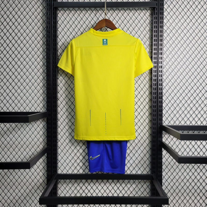 kit-conjunto-infantil-camisa-shorts-al-nassr-home-1-titular-2023-24-nike-torcedor-masculina-masculino-azul-amarelo-amarela-cr7-cristiano-ronaldo-talisca-mane-kafd-aroya-arabia-saudita

